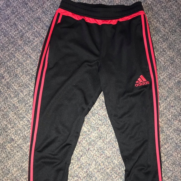 red and black adidas pants